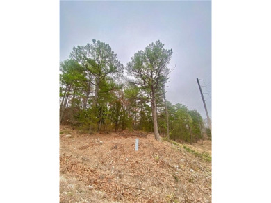 This beautiful, rural lot in Holiday Island, Arkansas on Holiday Island Golf Course in Arkansas - for sale on GolfHomes.com, golf home, golf lot