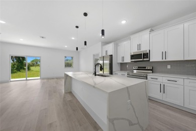 Welcome to this exceptional new 2024 construction coastal on Rotonda Golf and Country Club - Long Marsh  in Florida - for sale on GolfHomes.com, golf home, golf lot