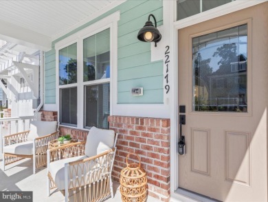 Welcome to 22179 Dune Circle, a stunning end-unit townhome in on The Peninsula Golf and Country Club in Delaware - for sale on GolfHomes.com, golf home, golf lot