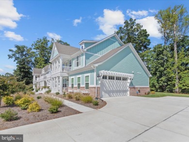 Welcome to 22179 Dune Circle, a stunning end-unit townhome in on The Peninsula Golf and Country Club in Delaware - for sale on GolfHomes.com, golf home, golf lot