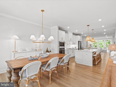 Welcome to 22179 Dune Circle, a stunning end-unit townhome in on The Peninsula Golf and Country Club in Delaware - for sale on GolfHomes.com, golf home, golf lot