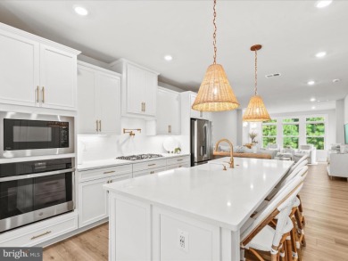 Welcome to 22179 Dune Circle, a stunning end-unit townhome in on The Peninsula Golf and Country Club in Delaware - for sale on GolfHomes.com, golf home, golf lot