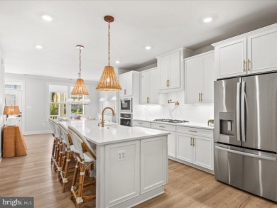 Welcome to 22179 Dune Circle, a stunning end-unit townhome in on The Peninsula Golf and Country Club in Delaware - for sale on GolfHomes.com, golf home, golf lot