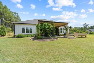 From the moment you arrive at this residence, you will know that on Canongate At Healy Point Country Club in Georgia - for sale on GolfHomes.com, golf home, golf lot