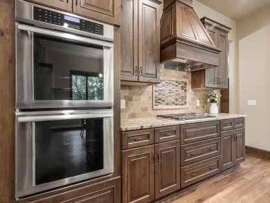 This custom-built, one-level home sits on 2.5 beautifully on Ridges At Sand Creek in Minnesota - for sale on GolfHomes.com, golf home, golf lot
