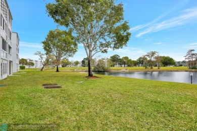 COME SEE THIS BEAUTIFUL GROUND FLOOR 2 BEDROOM 2 BATH HOME IN on  in Florida - for sale on GolfHomes.com, golf home, golf lot