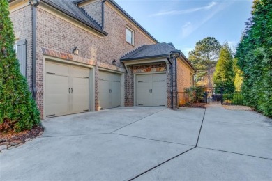 Experience timeless elegance in this stunning brick and stone on TPC At Sugarloaf Golf Club in Georgia - for sale on GolfHomes.com, golf home, golf lot