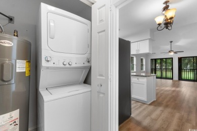 Nestled within the prestigious Weehawka Woods of Pawleys on Pawleys Plantation Golf and Country Club in South Carolina - for sale on GolfHomes.com, golf home, golf lot