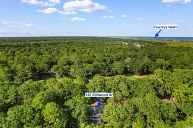 Nestled within the prestigious Weehawka Woods of Pawleys on Pawleys Plantation Golf and Country Club in South Carolina - for sale on GolfHomes.com, golf home, golf lot