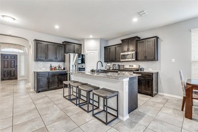 Welcome to this well-maintained 4-bedroom, 3.5-bath two-story on The Golf Club At Champions Circle in Texas - for sale on GolfHomes.com, golf home, golf lot