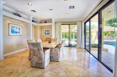 Experience unparalleled elegance in the heart of Boca Grove! on Boca Grove Golf and Tennis in Florida - for sale on GolfHomes.com, golf home, golf lot