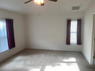 This 1,489 square foot is awaiting your updates. Enter through on Tampa Bay Golf and Country Club in Florida - for sale on GolfHomes.com, golf home, golf lot