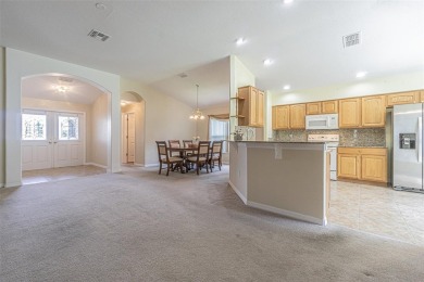 This 1,489 square foot is awaiting your updates. Enter through on Tampa Bay Golf and Country Club in Florida - for sale on GolfHomes.com, golf home, golf lot