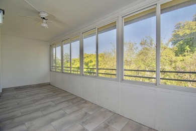 Fully renovated open concept kitchen with s/s appliances, quartz on Wynmoor Golf Course in Florida - for sale on GolfHomes.com, golf home, golf lot