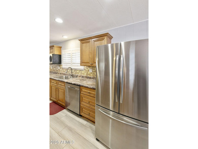 Enjoy easy living in this beautifully maintained 2BR/2BA on Fountain of the Sun Country Club in Arizona - for sale on GolfHomes.com, golf home, golf lot