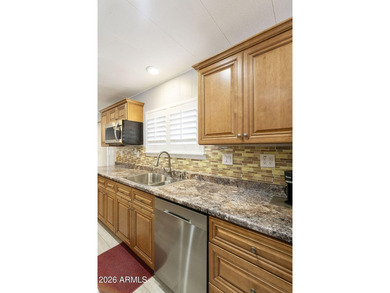 Enjoy easy living in this beautifully maintained 2BR/2BA on Fountain of the Sun Country Club in Arizona - for sale on GolfHomes.com, golf home, golf lot