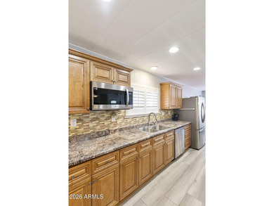 Enjoy easy living in this beautifully maintained 2BR/2BA on Fountain of the Sun Country Club in Arizona - for sale on GolfHomes.com, golf home, golf lot