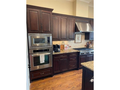 Showcase listing in the gated townhomes in Windermere Golf & on Windermere Golf Club in Georgia - for sale on GolfHomes.com, golf home, golf lot