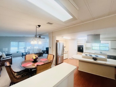 Welcome to this spacious 2-bedroom, 2-bath home located gated on Lake Fairways Country Club in Florida - for sale on GolfHomes.com, golf home, golf lot