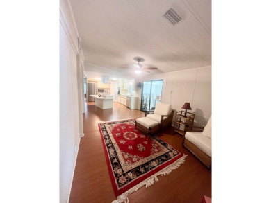Welcome to this spacious 2-bedroom, 2-bath home located gated on Lake Fairways Country Club in Florida - for sale on GolfHomes.com, golf home, golf lot