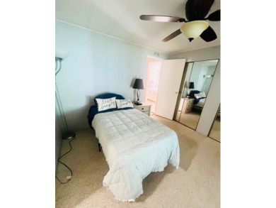 Welcome to this spacious 2-bedroom, 2-bath home located gated on Lake Fairways Country Club in Florida - for sale on GolfHomes.com, golf home, golf lot