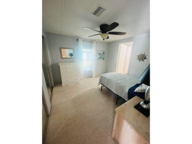 Welcome to this spacious 2-bedroom, 2-bath home located gated on Lake Fairways Country Club in Florida - for sale on GolfHomes.com, golf home, golf lot