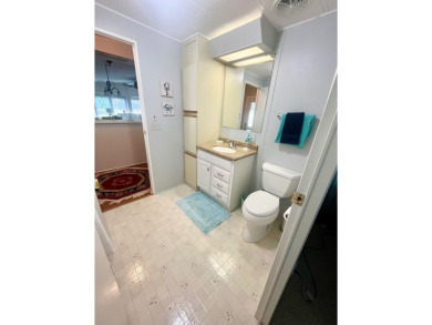 Welcome to this spacious 2-bedroom, 2-bath home located gated on Lake Fairways Country Club in Florida - for sale on GolfHomes.com, golf home, golf lot