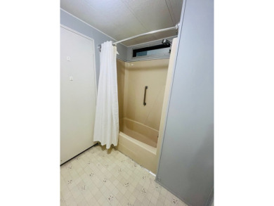 Welcome to this spacious 2-bedroom, 2-bath home located gated on Lake Fairways Country Club in Florida - for sale on GolfHomes.com, golf home, golf lot