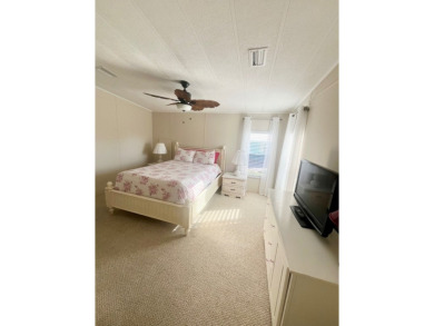 Welcome to this spacious 2-bedroom, 2-bath home located gated on Lake Fairways Country Club in Florida - for sale on GolfHomes.com, golf home, golf lot