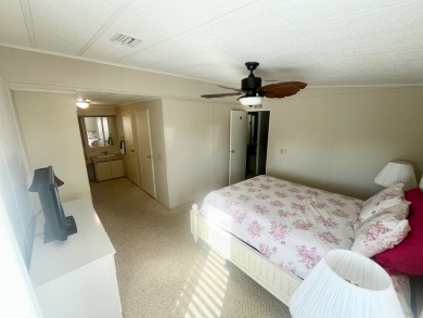 Welcome to this spacious 2-bedroom, 2-bath home located gated on Lake Fairways Country Club in Florida - for sale on GolfHomes.com, golf home, golf lot