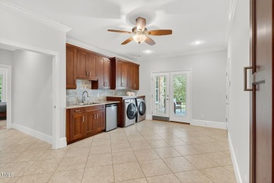 This custom-designed all brick estate on 1.2 acres offers nearly on Chicora Golf Course in North Carolina - for sale on GolfHomes.com, golf home, golf lot