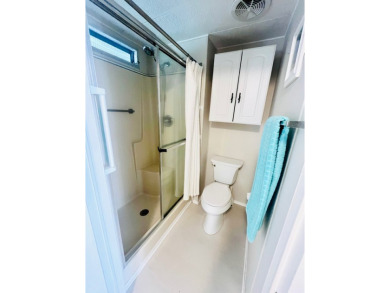 Welcome to this spacious 2-bedroom, 2-bath home located gated on Lake Fairways Country Club in Florida - for sale on GolfHomes.com, golf home, golf lot