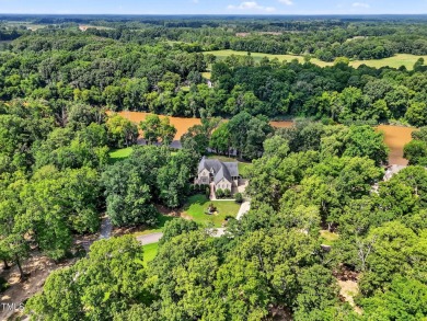 This custom-designed all brick estate on 1.2 acres offers nearly on Chicora Golf Course in North Carolina - for sale on GolfHomes.com, golf home, golf lot