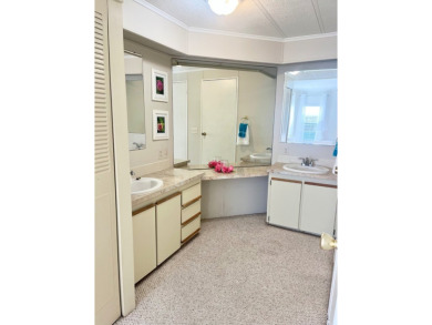 Welcome to this spacious 2-bedroom, 2-bath home located gated on Lake Fairways Country Club in Florida - for sale on GolfHomes.com, golf home, golf lot