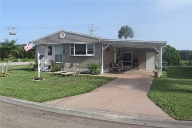 This cozy corner-lot home is full of potential and ready for on Barefoot Bay Golf Course in Florida - for sale on GolfHomes.com, golf home, golf lot