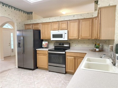 Welcome to this beautifully updated St. Clair model, perfectly on Kings Ridge Golf Club in Florida - for sale on GolfHomes.com, golf home, golf lot