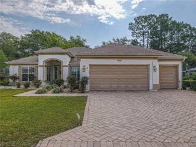Fabulous Santa Rosa model boasts brick pavers on driveway and on Eagle Ridge At Spruce Creek Country Club in Florida - for sale on GolfHomes.com, golf home, golf lot