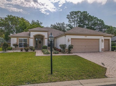 Fabulous Santa Rosa model boasts brick pavers on driveway and on Eagle Ridge At Spruce Creek Country Club in Florida - for sale on GolfHomes.com, golf home, golf lot