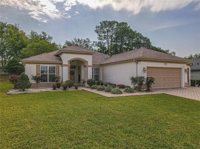 Fabulous Santa Rosa model boasts brick pavers on driveway and on Eagle Ridge At Spruce Creek Country Club in Florida - for sale on GolfHomes.com, golf home, golf lot