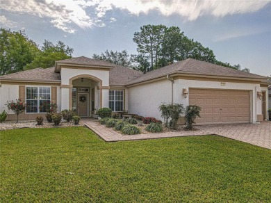 Fabulous Santa Rosa model boasts brick pavers on driveway and on Eagle Ridge At Spruce Creek Country Club in Florida - for sale on GolfHomes.com, golf home, golf lot