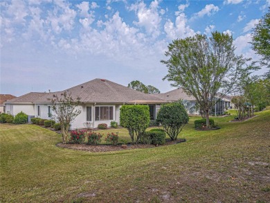 Fabulous Santa Rosa model boasts brick pavers on driveway and on Eagle Ridge At Spruce Creek Country Club in Florida - for sale on GolfHomes.com, golf home, golf lot