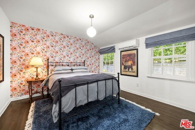 Tucked behind lush landscaping on one of the most coveted and on Los Angeles Country Club in California - for sale on GolfHomes.com, golf home, golf lot