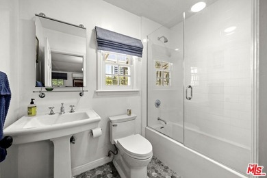 Tucked behind lush landscaping on one of the most coveted and on Los Angeles Country Club in California - for sale on GolfHomes.com, golf home, golf lot