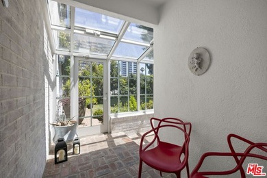 Tucked behind lush landscaping on one of the most coveted and on Los Angeles Country Club in California - for sale on GolfHomes.com, golf home, golf lot