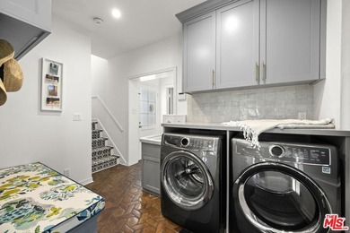 Tucked behind lush landscaping on one of the most coveted and on Los Angeles Country Club in California - for sale on GolfHomes.com, golf home, golf lot