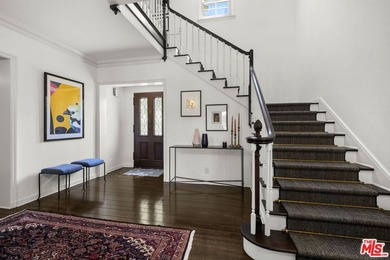 Tucked behind lush landscaping on one of the most coveted and on Los Angeles Country Club in California - for sale on GolfHomes.com, golf home, golf lot