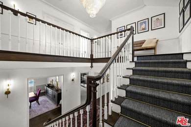 Tucked behind lush landscaping on one of the most coveted and on Los Angeles Country Club in California - for sale on GolfHomes.com, golf home, golf lot