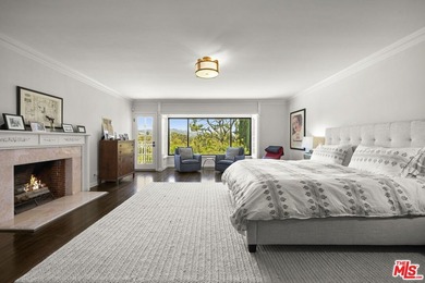 Tucked behind lush landscaping on one of the most coveted and on Los Angeles Country Club in California - for sale on GolfHomes.com, golf home, golf lot