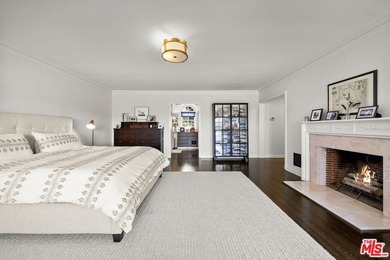 Tucked behind lush landscaping on one of the most coveted and on Los Angeles Country Club in California - for sale on GolfHomes.com, golf home, golf lot