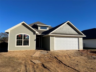 New construction! Located on a quiet street with no neighbor to on Lake Kiowa Golf Course in Texas - for sale on GolfHomes.com, golf home, golf lot